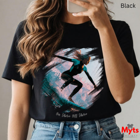 Person wearing a black t-shirt with a graphic design, holding a phone.