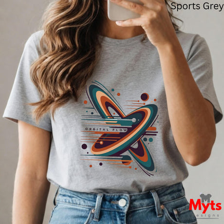 Person wearing a gray t-shirt with a colorful graphic design, taking a selfie.