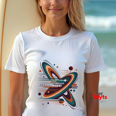 Person wearing a white t-shirt with a colorful graphic design on a beach.