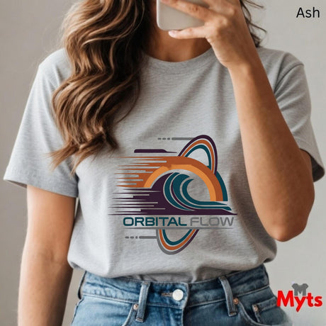 Person wearing a gray t-shirt with 'Orbital Flow' design and holding a phone.