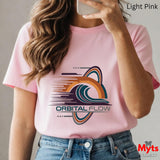 Person wearing a pink t-shirt with 'Orbital Flow' design, holding a phone.