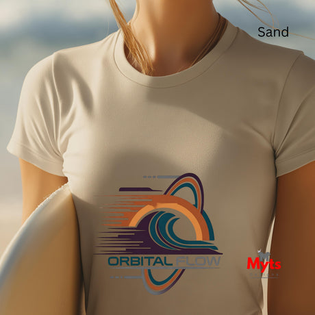 Person wearing a Sand t-shirt with 'Orbital Flow' logo against a beach background