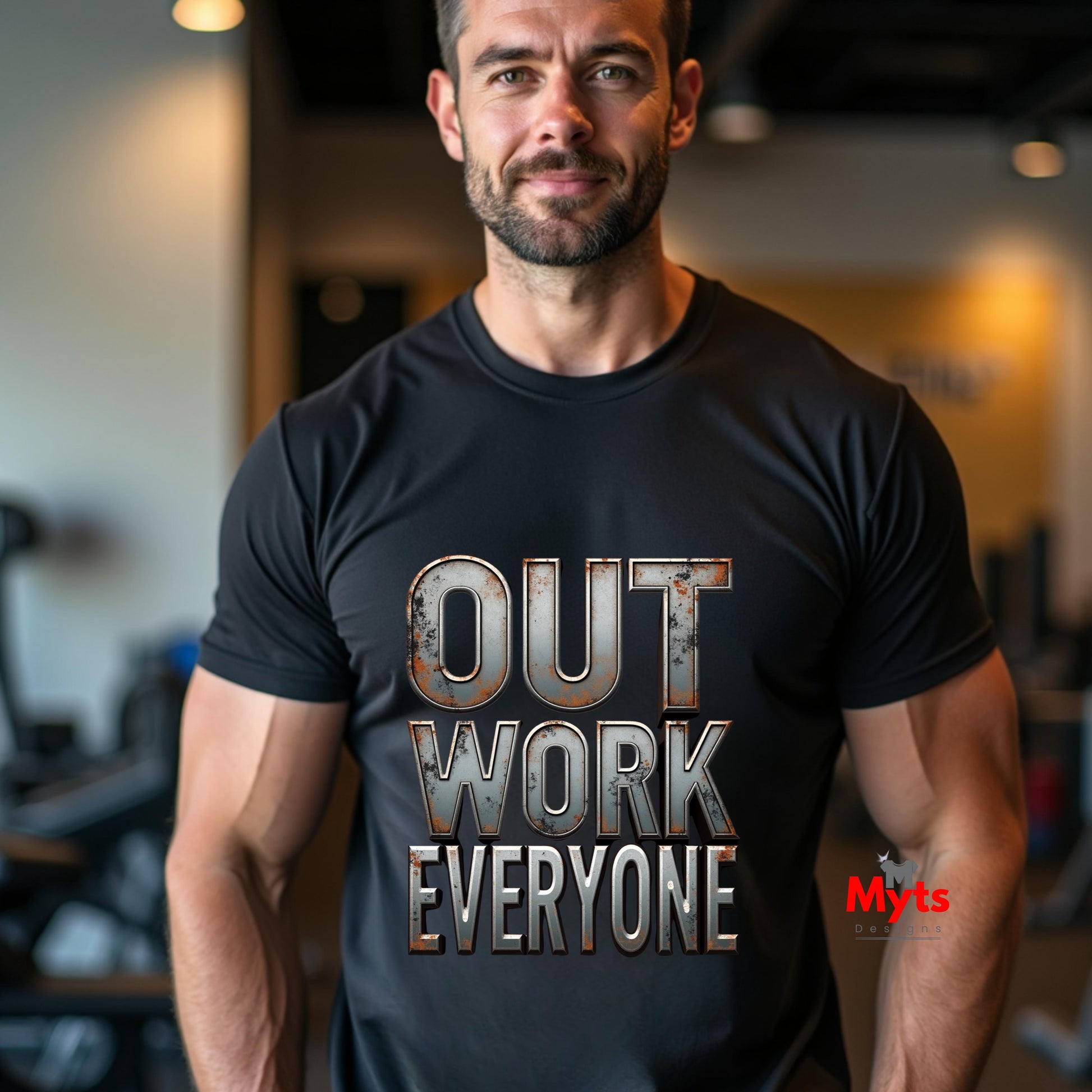 Man wearing a black t-shirt with 'OUT WORK EVERYONE' text in a gym setting