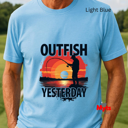 Light blue t-shirt with a fishing graphic and text 'Outfish Yesterday' on a grassy background.