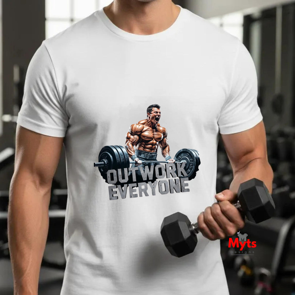 Person wearing a white t-shirt with a fitness graphic and text, holding dumbbells in a gym setting.