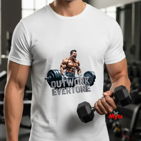 Person wearing a white t-shirt with a fitness graphic and text, holding dumbbells in a gym setting.
