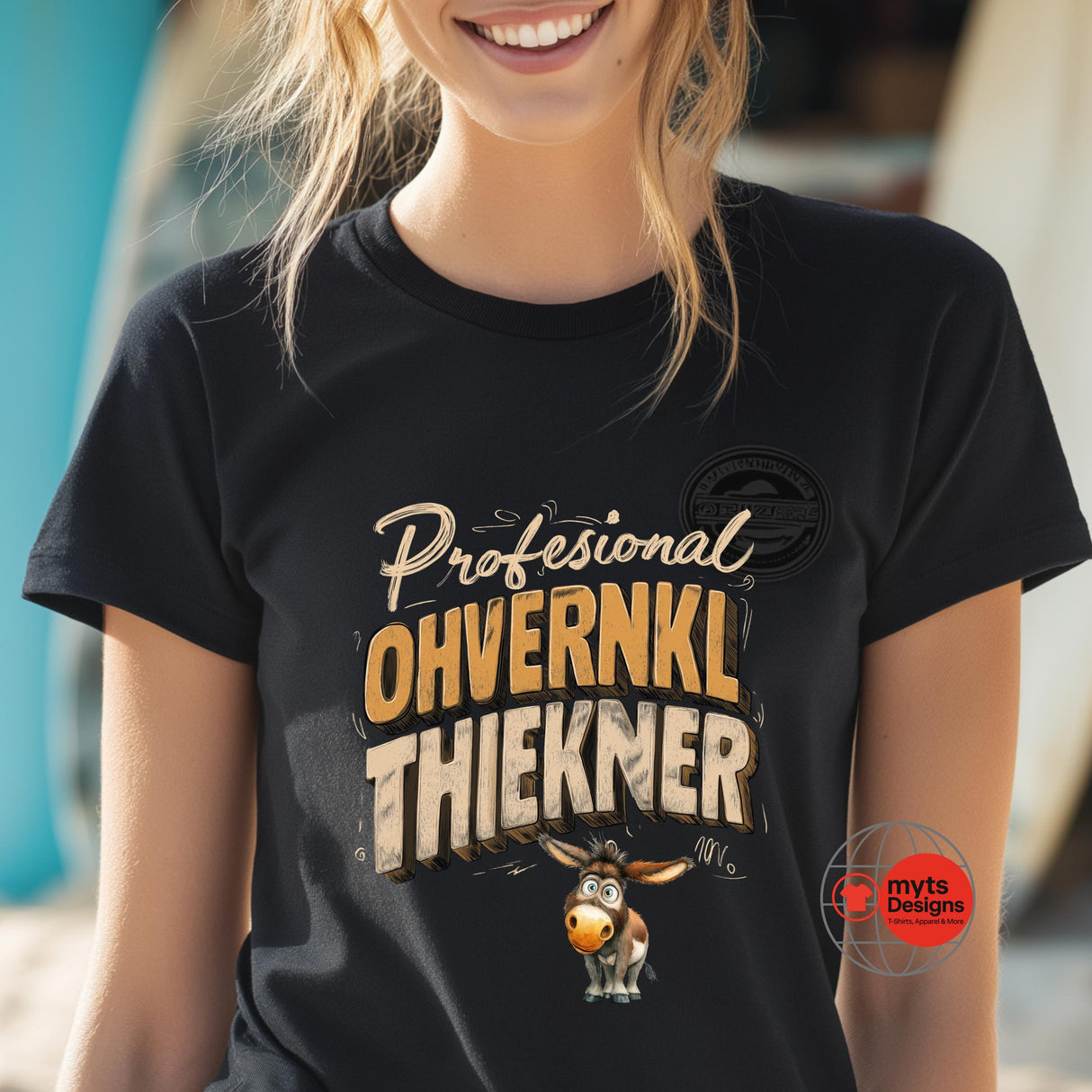 Person wearing a black t-shirt with a humorous design and text.