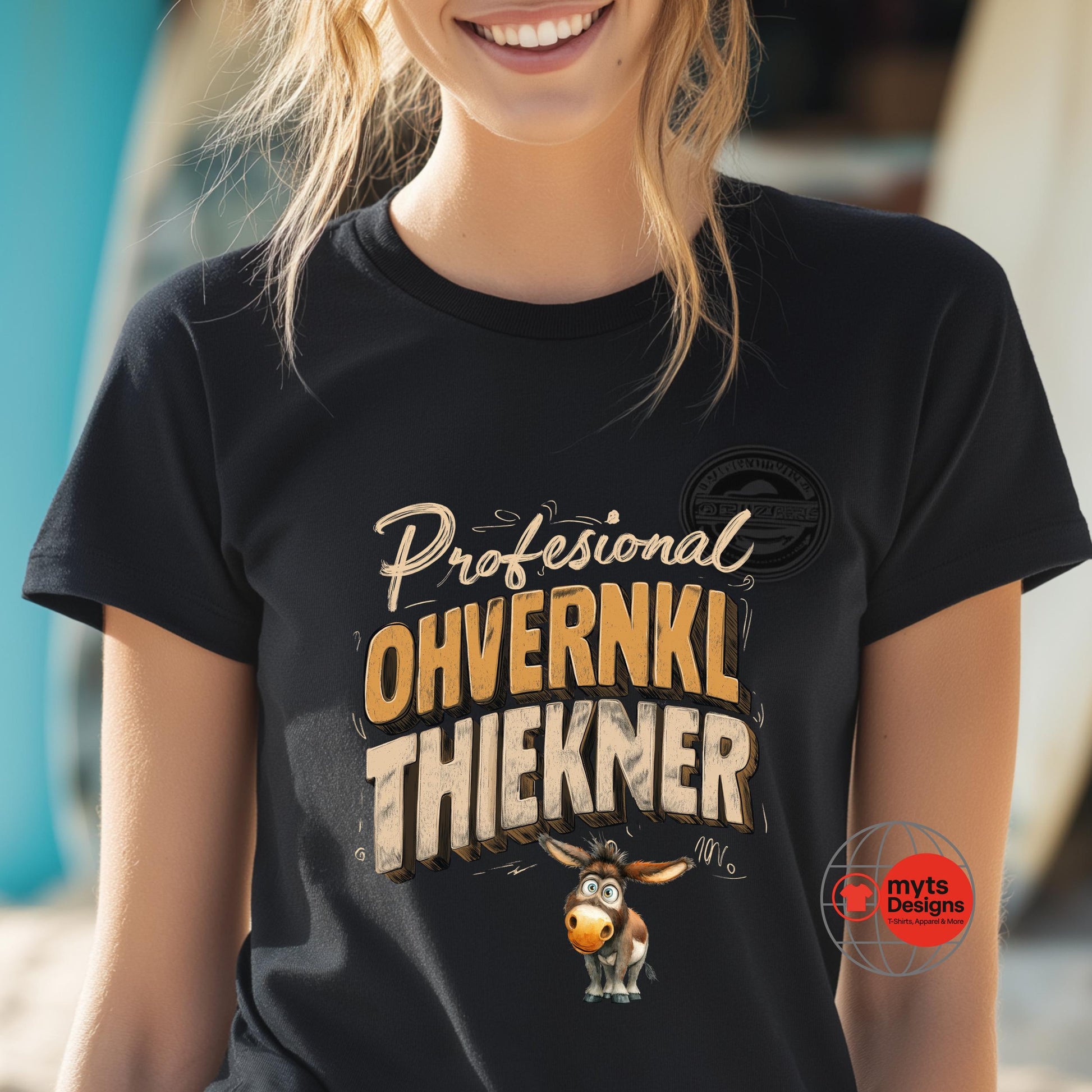 Person wearing a black t-shirt with a humorous design and text.