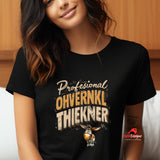 Person wearing a black t-shirt with text and a donkey graphic