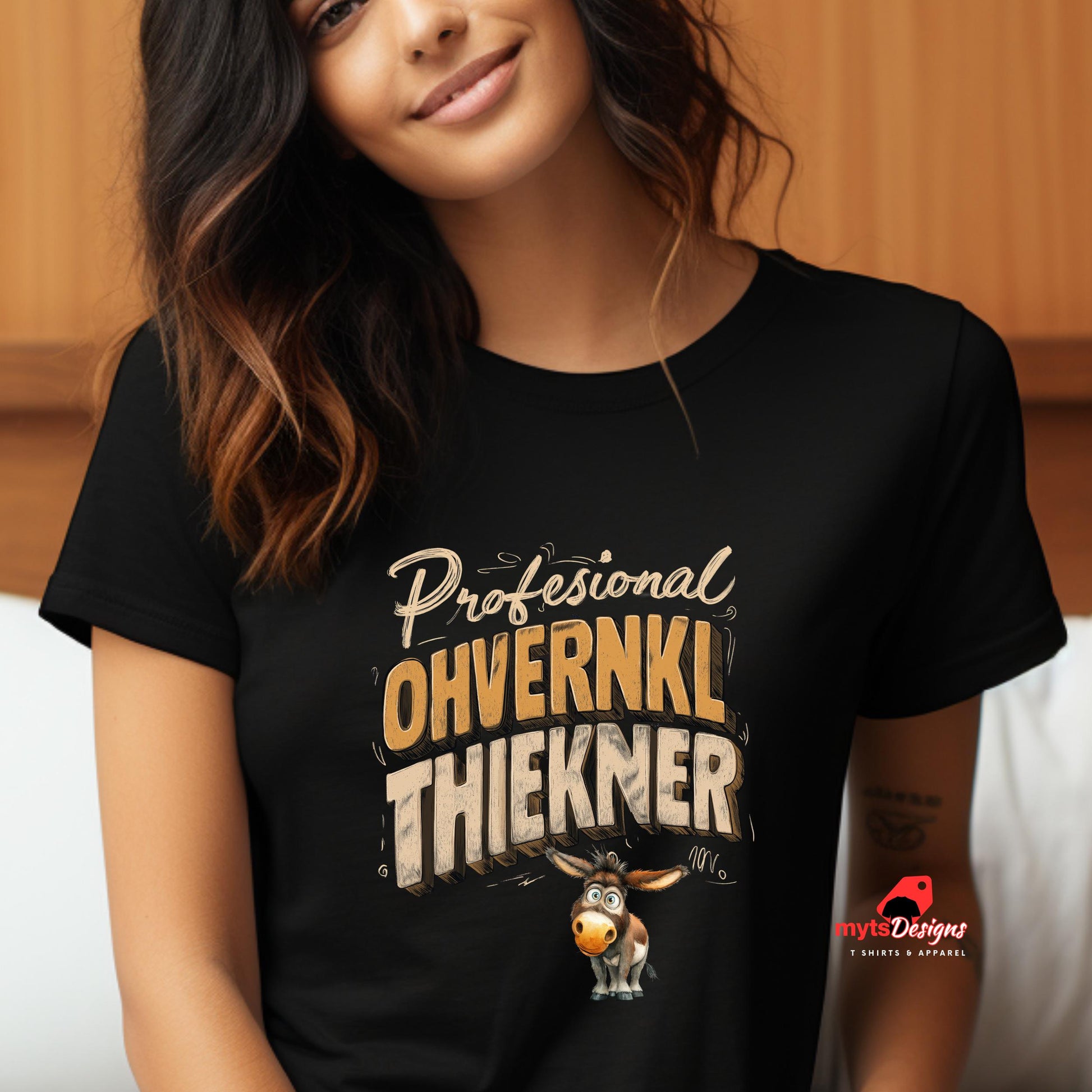 Person wearing a black t-shirt with text and a donkey graphic