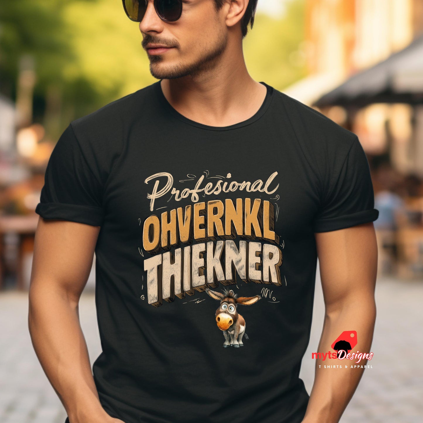 Man wearing a black t-shirt with humorous text and donkey graphic, standing outdoors.