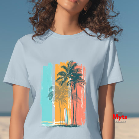 Person wearing a light blue t-shirt with a colorful palm tree design on a beach.