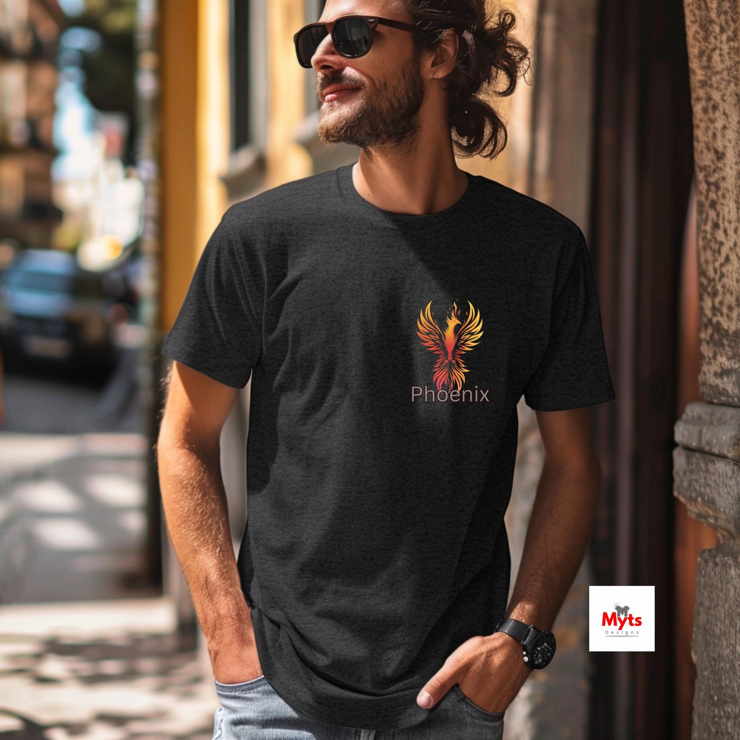 Man wearing a black t-shirt with a phoenix logo on a city street