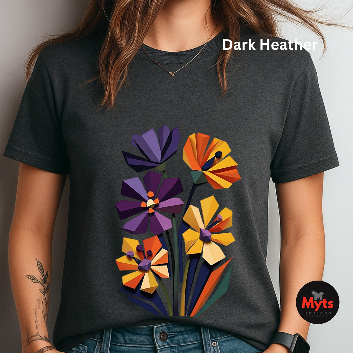 Dark Heather geometric wildflower T-shirt featuring colourful abstract flowers in purple, orange, yellow, navy and green with angular modern petals.
