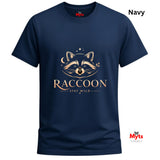 A navy blue short-sleeve t-shirt with a gold graphic of a raccoon's face and the text 'RACCOON STAY WILD' on the front. The brand name 'Myts' is visible on the inner neck label and as a watermark in the bottom right corner.