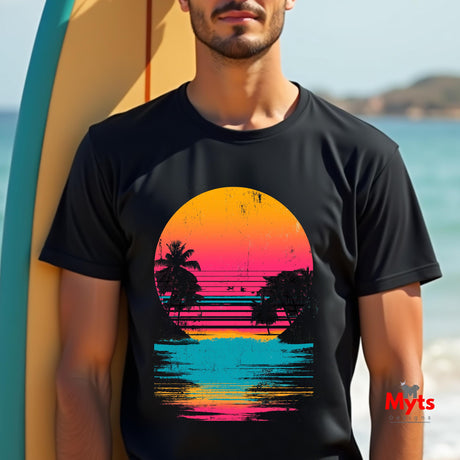 Person wearing a black t-shirt with a colorful sunset design on a beach.