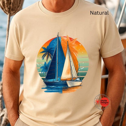 Natural t-shirt with a sailboat and sunset design worn by a person, with 'Nats Designs' logo in the corner.