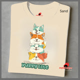 cartoon puppies t-shirt
A folded sand T-shirt featuring a colorful graphic of four stacked cartoon puppies in teal, orange, cream, and yellow shades with the words “Puppy Love” in playful green text below
