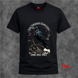 Black t-shirt with a crow and text design on a gray background