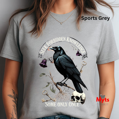 Gray t-shirt with a crow design and text, worn by a person.