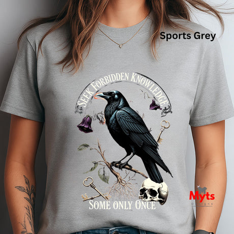 Gray t-shirt with a crow design and text, worn by a person.