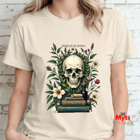 A woman wearing a T-shirt with a skull and books design, featuring the brand 'Myts'.