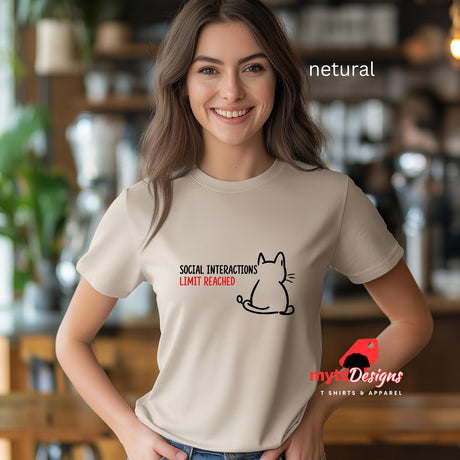 “Netrual T-shirt wor by a young woman with a minimal line art cat and text reading ‘Social Interactions Limit Reached’ in bold black and red font, humorous introvert design from MytsDesigns.com”
