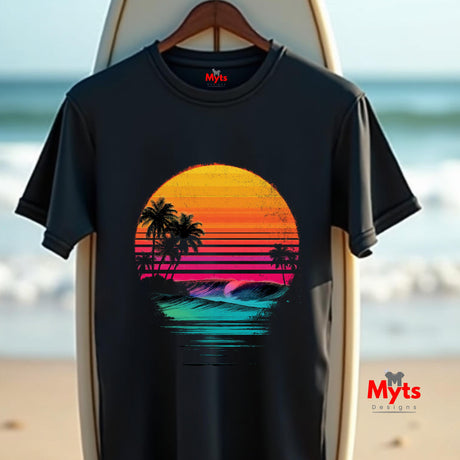 Black t-shirt with a colorful sunset design on a surfboard with a beach background