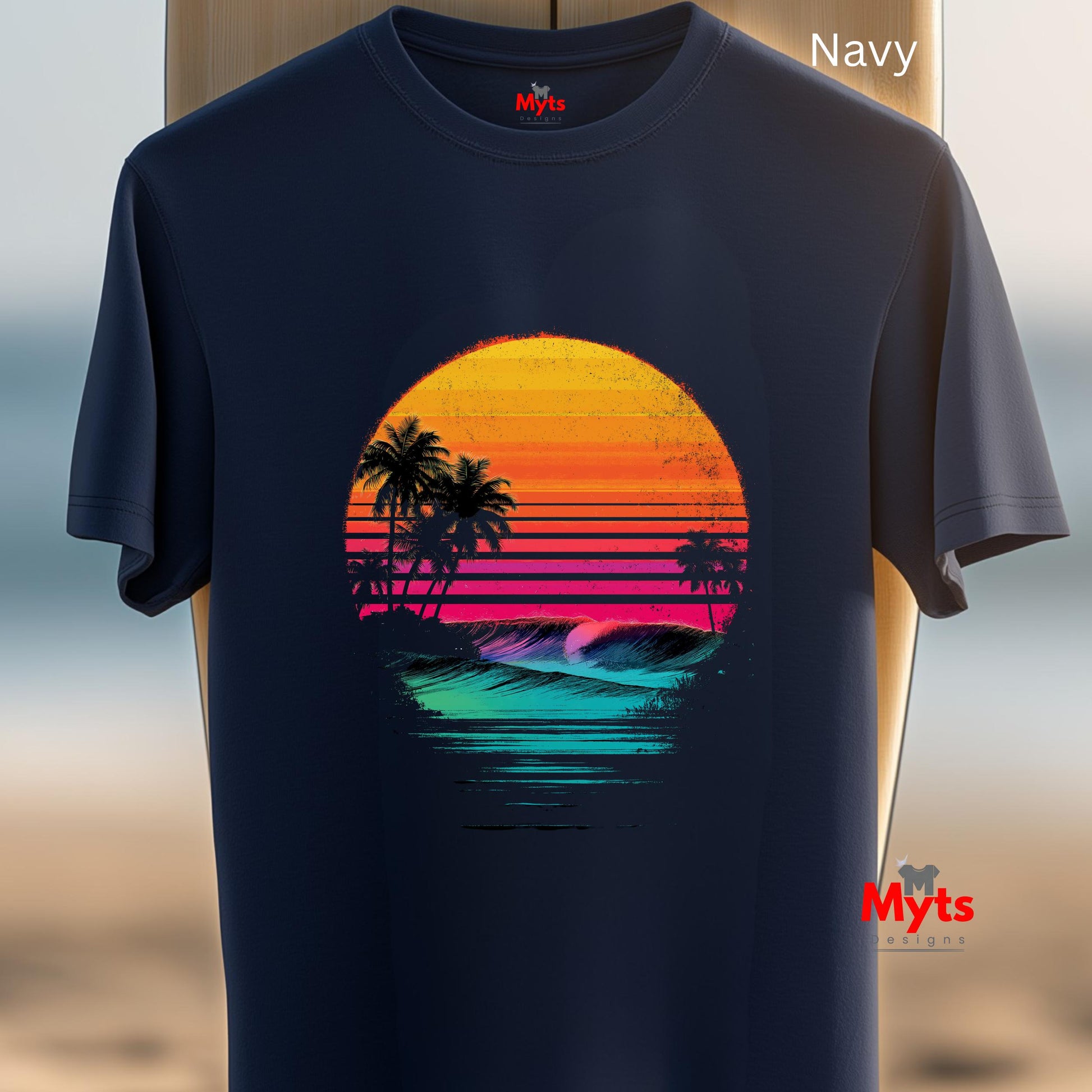 Navy t-shirt with a colorful sunset and palm tree design on a blurred beach background