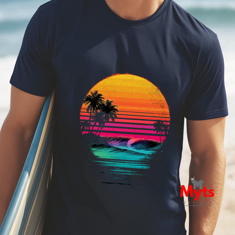 Person wearing a navy blue t-shirt with a colorful sunset design on a beach.