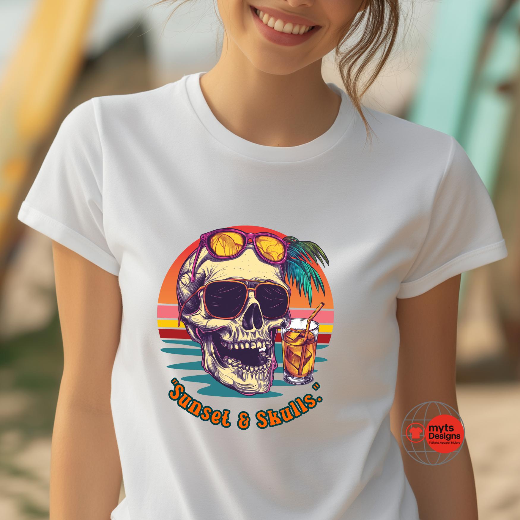T-shirt featuring a retro-style skull with sunglasses, palm tree, tropical cocktail, and sunset background. "Sunset & Skulls" printed below. Worn by smiling woman at the beach.