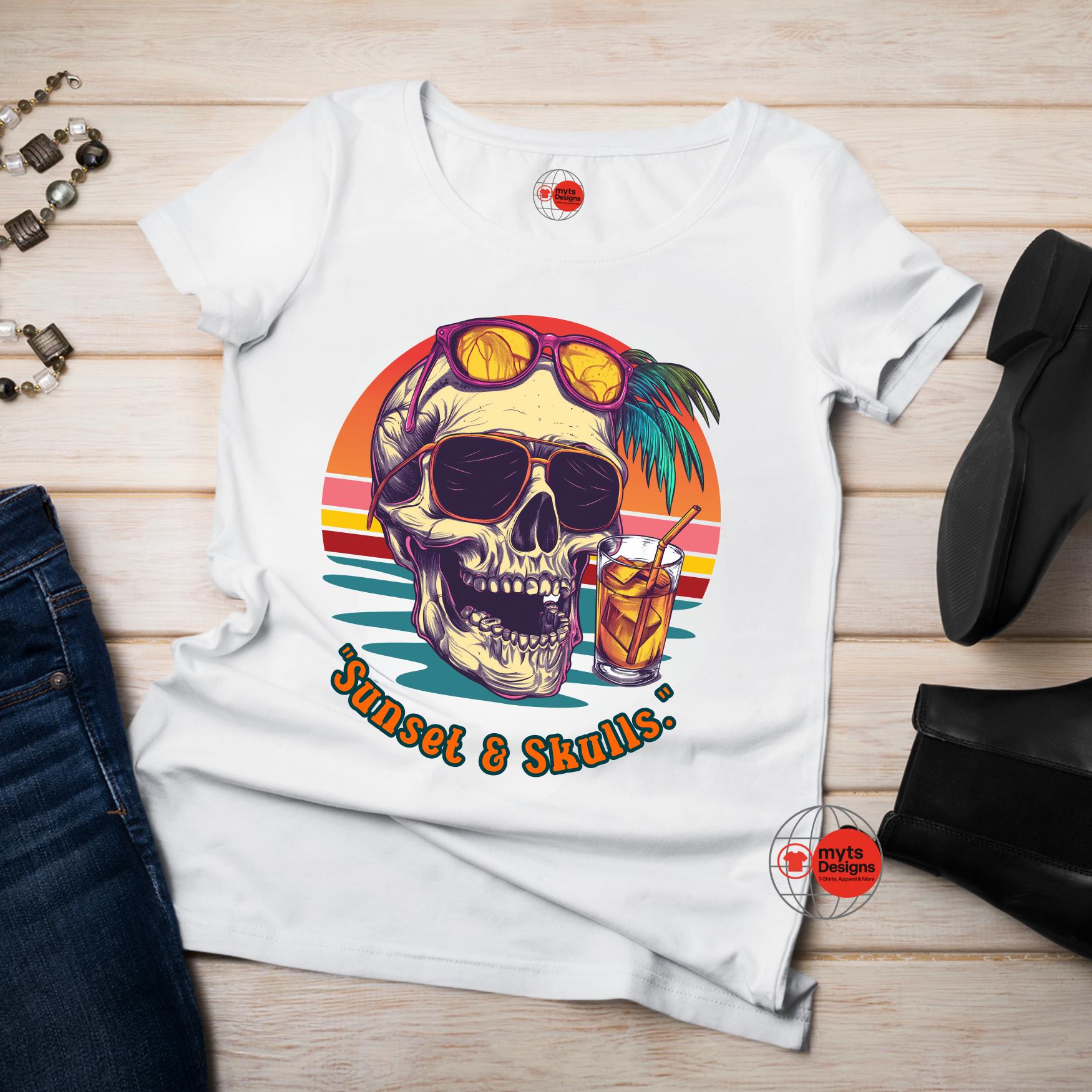 White t-shirt with a colorful skull design and 'Sunset & Skulls' text on a wooden surface.