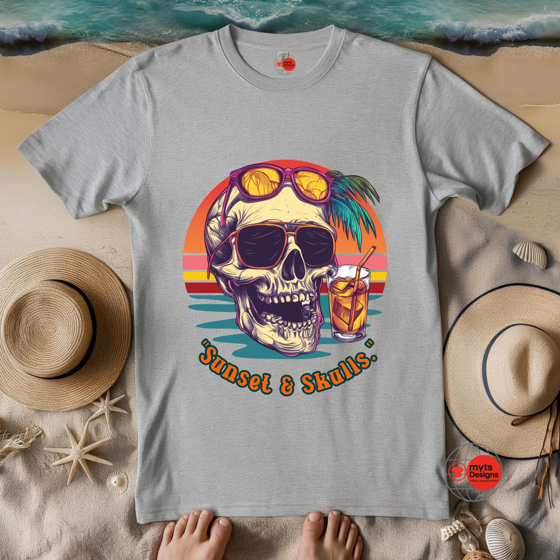 Gray t-shirt with 'Sunset & Skulls' design on a beach setting