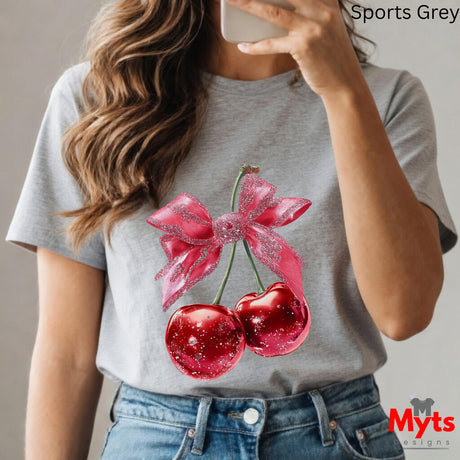 Person wearing a gray t-shirt with cherry design, taking a selfie.
