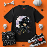 Black t-shirt with witch design on an orange background with Halloween-themed items.