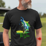 Man wearing a black t-shirt with a colorful graphic design on a golf course.