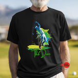 Person wearing a black t-shirt with a colorful graphic and 'The Drive' text on a golf course.