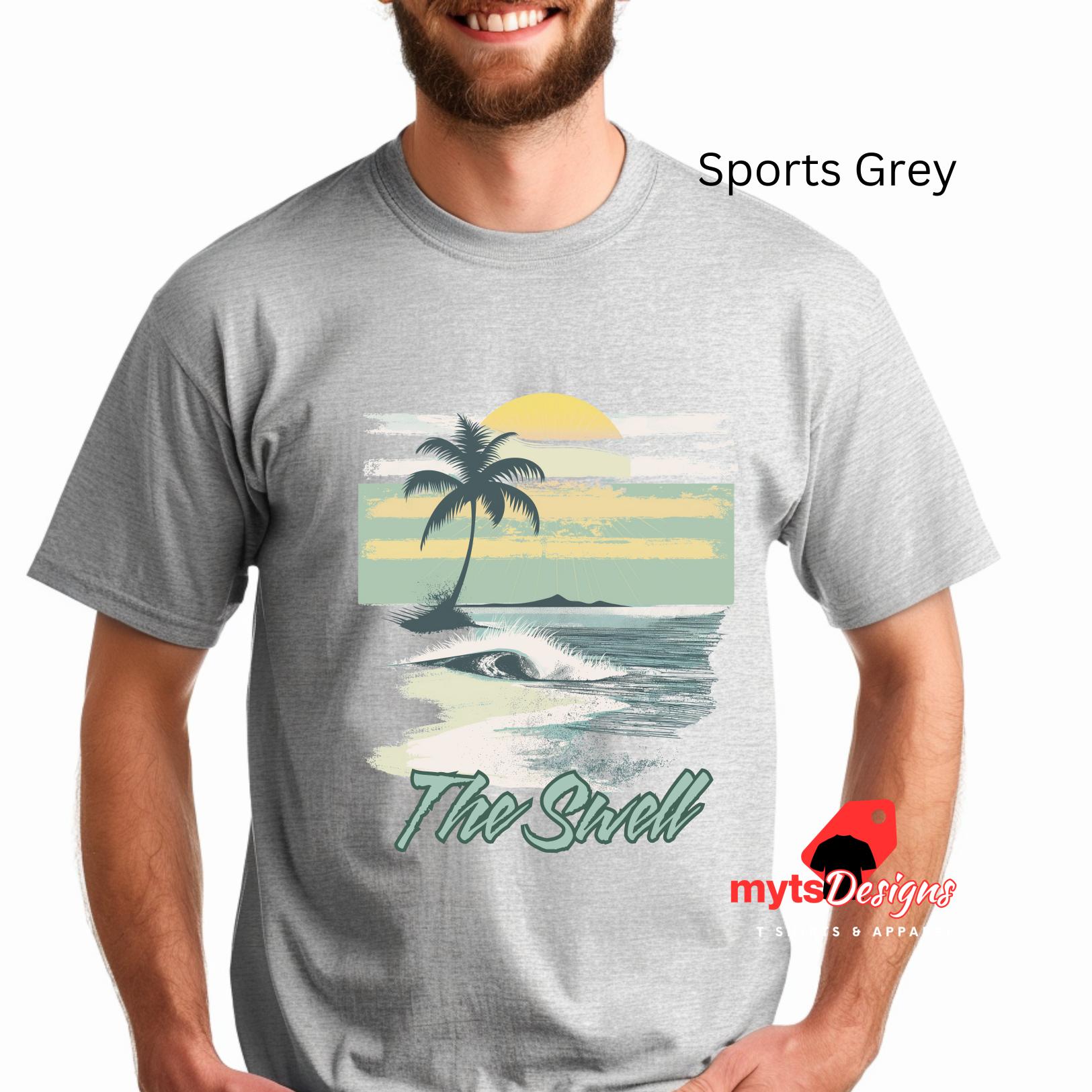 Person wearing a gray t-shirt with a beach graphic and 'The Swell' text, brand 'mytDesigns' visible.