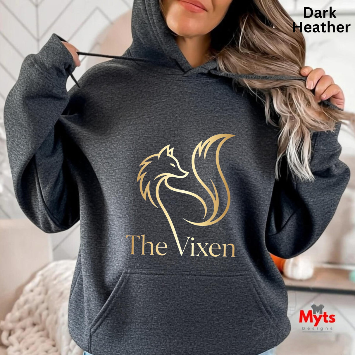 Dark Heather hoodie with 'The Vixen' logo and text, worn by a person.