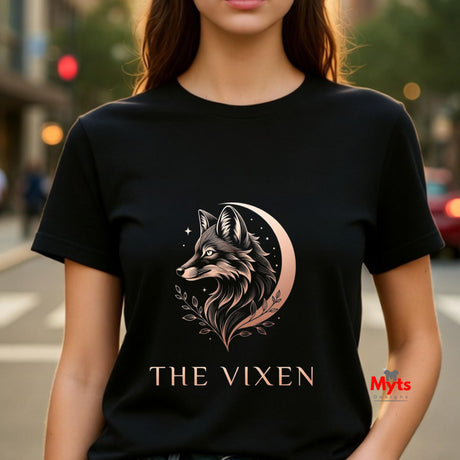 Woman wearing a black The Vixen Moon fox graphic T-shirt featuring a detailed celestial fox portrait, crescent moon, stars and botanical artwork.