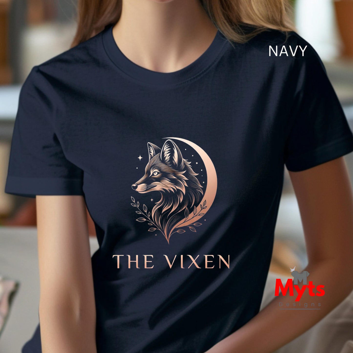 Woman wearing a Navy The Vixen Moon fox graphic T-shirt featuring a detailed celestial fox portrait, crescent moon, stars and botanical artwork.