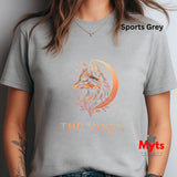 Woman wearing a Sports Grey The Vixen Moon fox graphic T-shirt featuring a detailed celestial fox portrait, crescent moon, stars and botanical artwork.
