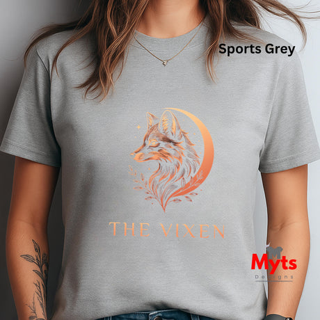 Woman wearing a Sports Grey The Vixen Moon fox graphic T-shirt featuring a detailed celestial fox portrait, crescent moon, stars and botanical artwork.