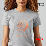 Woman wearing a Sports Grey The Vixen Moon fox graphic T-shirt featuring a detailed celestial fox portrait, crescent moon, stars and botanical artwork.