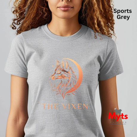 Woman wearing a Sports Grey The Vixen Moon fox graphic T-shirt featuring a detailed celestial fox portrait, crescent moon, stars and botanical artwork.