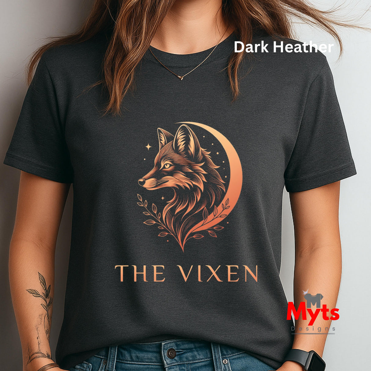 Woman wearing a Dark Heather The Vixen Moon fox graphic T-shirt featuring a detailed celestial fox portrait, crescent moon, stars and botanical artwork.