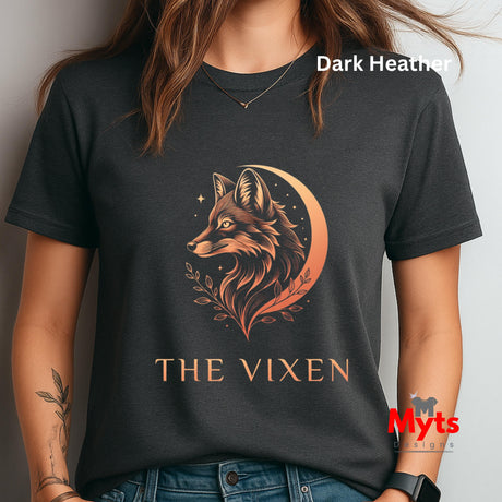 Woman wearing a Dark Heather The Vixen Moon fox graphic T-shirt featuring a detailed celestial fox portrait, crescent moon, stars and botanical artwork.