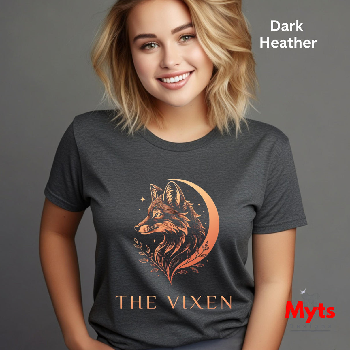 Woman wearing a Dark Heather The Vixen Moon fox graphic T-shirt featuring a detailed celestial fox portrait, crescent moon, stars and botanical artwork.