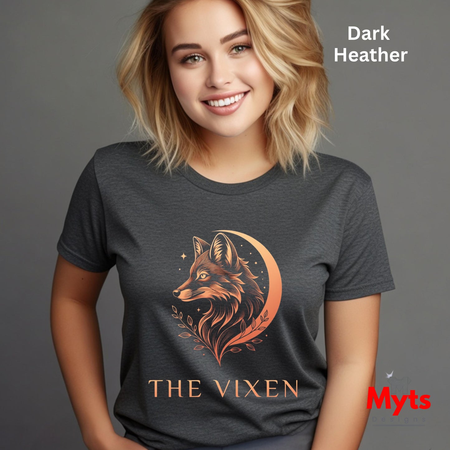 Woman wearing a Dark Heather The Vixen Moon fox graphic T-shirt featuring a detailed celestial fox portrait, crescent moon, stars and botanical artwork.