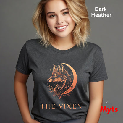 Woman wearing a Dark Heather The Vixen Moon fox graphic T-shirt featuring a detailed celestial fox portrait, crescent moon, stars and botanical artwork.